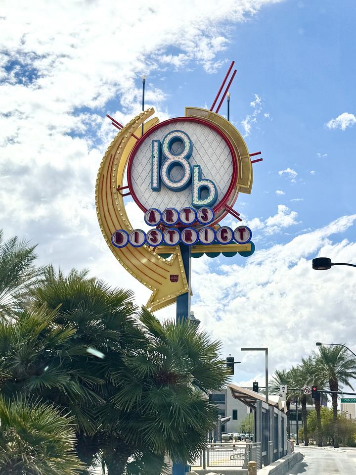 The 18b Arts District sign against a blue sky