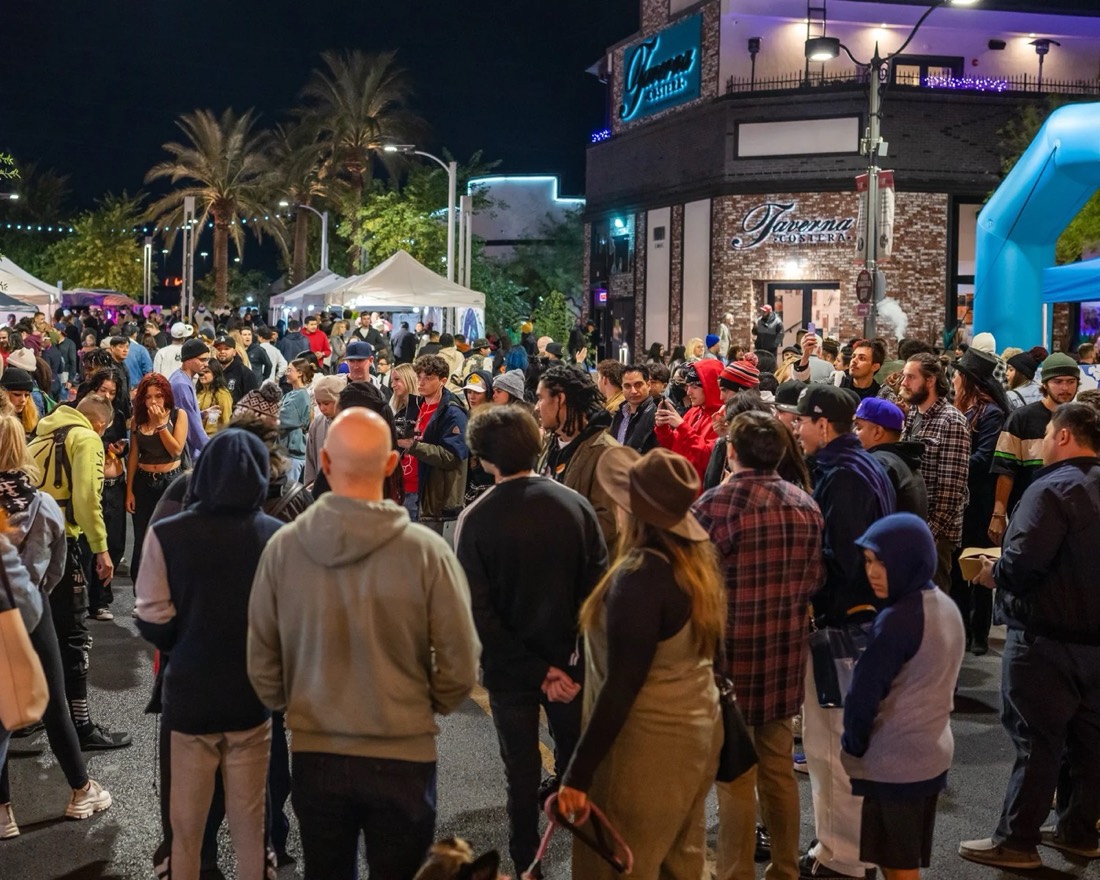 A crowd filling Main Street at night during First Friday